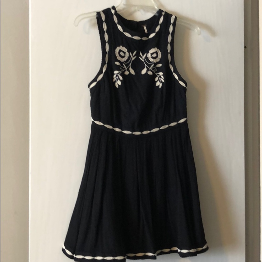 Black mini dress with cream embroidery
